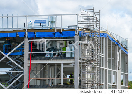 Truck Service Building Construction with Ventilation Equipment Installation and Steel Frame Assembly Site Truck Service Building Construction with Ventilation Equipment Installation and Steel Frame Assembly Site 141258224
