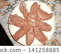 Very strange sweet cake decorated to look like covered with excrement 141258885