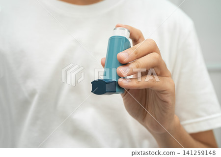 Asthma and chronic obstructive pulmonary disease COPD, Asian teenage using metered dose inhaler MDI. 141259148