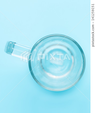 Empty transparent beer mug blue background Empty transparent beer mug blue background 141259151