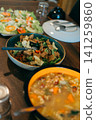 Delicious-looking dishes laid out on the table 141259860