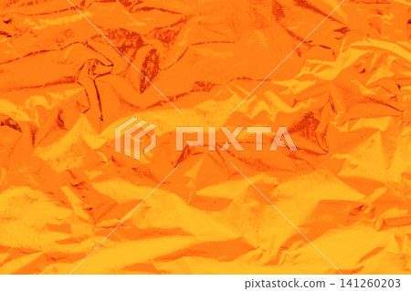 Foil crumpled texture wrinkled material abstract pattern surface background structure backdrop vibrant bright orange Foil crumpled texture wrinkled material abstract pattern surface background structure backdrop vibrant bright orange 141260203