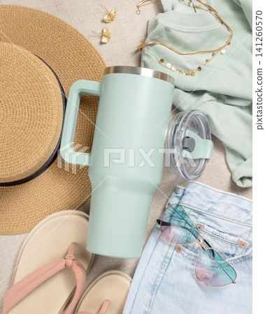 Blank sage green 40oz tumbler mockup, stainless steel travel thermos on denim and dark red sweatshirt Blank sage green 40oz tumbler mockup, stainless steel travel thermos on denim and dark red sweatshirt 141260570