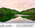 A pond in the mountains at dusk A pond in the mountains at dusk 141260997