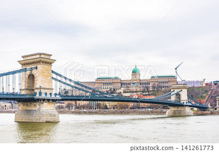 The view of the Széchenyi Chain Bridge and Buda Castle over the Danube River, a UNESCO World Heritage Site in Budapest, Hungary. The view of the Széchenyi Chain Bridge and Buda Castle over the Danube River, a UNESCO World Heritage Site in Budapest, Hungary. 141261773
