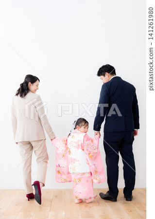A family having their Shichi-Go-San photos taken. A family having their Shichi-Go-San photos taken. 141261980