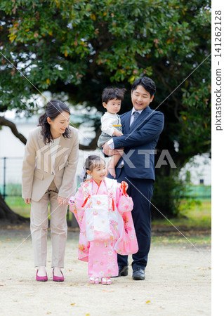Young family, parent and child, Shichi-Go-San (traditional Japanese festival for children), outdoors, family Young family, parent and child, Shichi-Go-San (traditional Japanese festival for children), outdoors, family 141262128