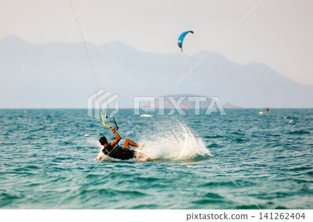 Kitesurfer Crashing Into Water With Splash After Fall Kitesurfer Crashing Into Water With Splash After Fall 141262404