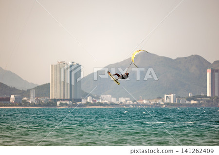 Kitesurfer High Jump With Other Riders and Kites 141262409