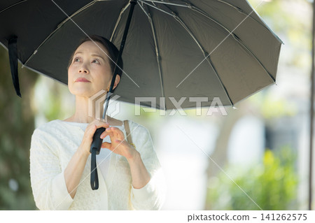 Senior woman sunblind Senior woman sunblind 141262575