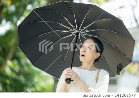 Senior woman sunblind Senior woman sunblind 141262577