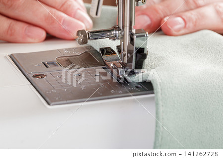 Sewing machine, stitching fabrics, needle in a round plan Sewing machine, stitching fabrics, needle in a round plan 141262728