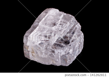 Macro mineral stone Iceland spar on black background Macro mineral stone Iceland spar on black background 141262811