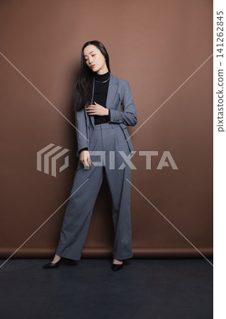 A woman in a stylish suit 141262845
