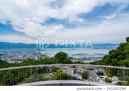 Stunning views of Lake Suwa and its surroundings from Tateishi Park during the summer season (Suwa City, Nagano Prefecture) Stunning views of Lake Suwa and its surroundings from Tateishi Park during the summer season (Suwa City, Nagano Prefecture) 141263294