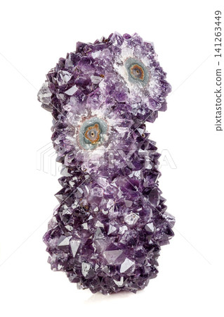 Macro mineral stone Amethyst eye, in the form of an owl on a white background Macro mineral stone Amethyst eye, in the form of an owl on a white background 141263449