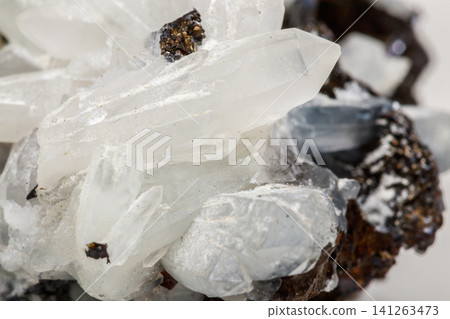 Macro mineral stone Drusus quartz with sphalerite in the rock a white background Macro mineral stone Drusus quartz with sphalerite in the rock a white background 141263473