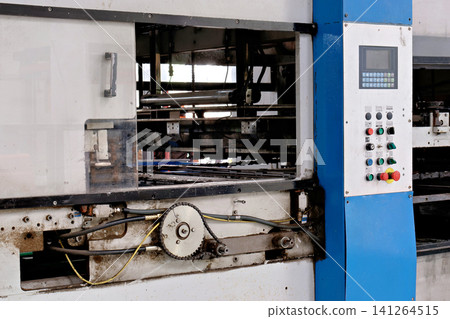 Industrial machine control panel with buttons next to a mechanical chain drive system Industrial machine control panel with buttons next to a mechanical chain drive system 141264515