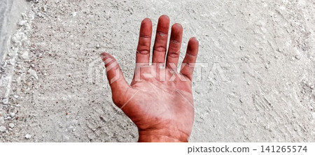 Open palm on a rough concrete floor Open palm on a rough concrete floor 141265574