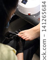 A woman's feet during a pedicure. Woman getting pedicure in beauty salon, closeup. A pedicurist working at a beauty salon. Manicure services. Nail art. Beauty salon concept: pedicures. A woman's feet during a pedicure. Woman getting pedicure in beauty salon, closeup. A pedicurist working at a beauty salon. Manicure services. Nail art. Beauty salon concept: pedicures. 141265684