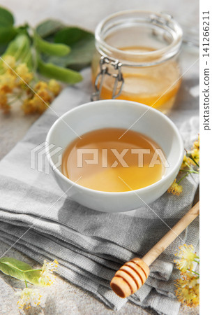 Natural linden blossom honey in bowl and jar Natural linden blossom honey in bowl and jar 141266211