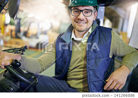 Man, portrait and forklift in warehouse for transport or distribution supply chain, import or delivery. Male person, face and hardhat for supplier in factory or manufacturing, courier or workshop Man, portrait and forklift in warehouse for transport or distribution supply chain, import or delivery. Male person, face and hardhat for supplier in factory or manufacturing, courier or workshop 141266886