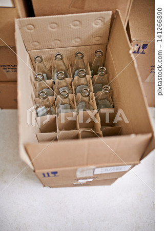 Empty beer bottle, box and storage in factory on floor, above and container for supply chain, process or delivery. Cardboard package, glass and brewery for alcohol, cider or production in warehouse Empty beer bottle, box and storage in factory on floor, above and container for supply chain, process or delivery. Cardboard package, glass and brewery for alcohol, cider or production in warehouse 141266890