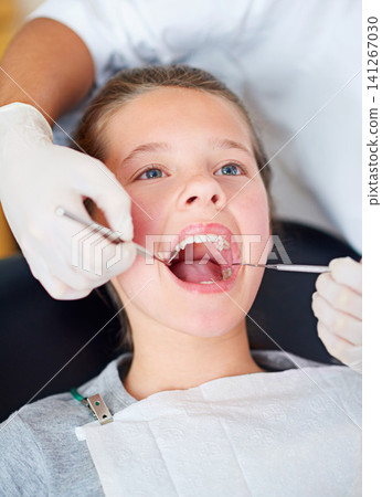 Girl, kid and mouth inspection at dentist for healthcare with dental tool, consultation or checkup for oral health. Expert, child patient and glove hand for teeth cleaning, gingivitis or medical care Girl, kid and mouth inspection at dentist for healthcare with dental tool, consultation or checkup for oral health. Expert, child patient and glove hand for teeth cleaning, gingivitis or medical care 141267030