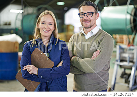 Warehouse, portrait and people with clipboard for supplying, inventory and boxes for shipping. Colleagues, teamwork and collaboration on import or export, factory and paper for logistics on delivery Warehouse, portrait and people with clipboard for supplying, inventory and boxes for shipping. Colleagues, teamwork and collaboration on import or export, factory and paper for logistics on delivery 141267134