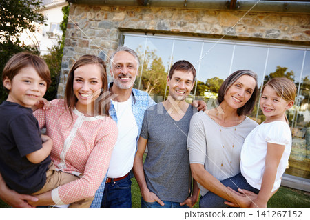 Portrait, smile and big family outdoor together by home for love and bonding at backyard. Face, parents and happy grandparents with kids at garden for connection with mother, father and children 141267152