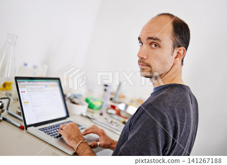Man, laptop and equipment in workshop, brewery and portrait with scroll, research and development. Person, computer and typing at factory on web for alcohol, craft beer and tools on desk in warehouse Man, laptop and equipment in workshop, brewery and portrait with scroll, research and development. Person, computer and typing at factory on web for alcohol, craft beer and tools on desk in warehouse 141267188