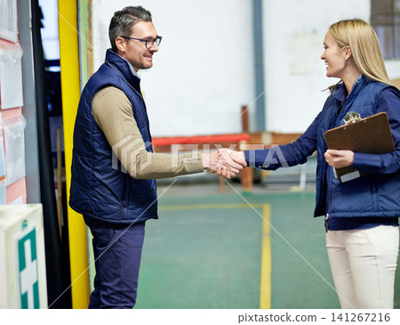 Business people, shaking hands and welcome for partnership, collaboration and agreement. Professional, clipboard and handshake for introduction, b2b onboarding or teamwork in shipping warehouse 141267216