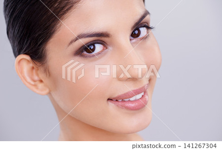 Woman, smile and portrait for cosmetology, dermatology and skincare for hygiene and aesthetic in studio. Model, lady and isolated with smooth face and makeup, eyeshadow and lipstick for full lips Woman, smile and portrait for cosmetology, dermatology and skincare for hygiene and aesthetic in studio. Model, lady and isolated with smooth face and makeup, eyeshadow and lipstick for full lips 141267304