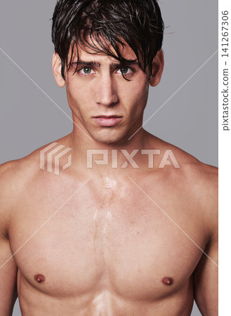 Man, portrait and muscle confidence for workout transformation or strong chest, grey background or bodybuilder. Male person, model and face in studio or mockup space for fitness, wellness or healthy Man, portrait and muscle confidence for workout transformation or strong chest, grey background or bodybuilder. Male person, model and face in studio or mockup space for fitness, wellness or healthy 141267306