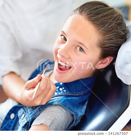 Girl, child and portrait at dentist for mouth with healthcare tool, consultation or dental inspection for oral health. Professional, kid patient or hand for teeth cleaning, gingivitis or medical care Girl, child and portrait at dentist for mouth with healthcare tool, consultation or dental inspection for oral health. Professional, kid patient or hand for teeth cleaning, gingivitis or medical care 141267307