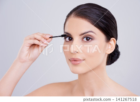 Makeup, mascara and brush with woman in portrait, beauty for lashes and cosmetology on white background. Skin, glow and transformation for makeover, cosmetic product and wand for eyelash with volume Makeup, mascara and brush with woman in portrait, beauty for lashes and cosmetology on white background. Skin, glow and transformation for makeover, cosmetic product and wand for eyelash with volume 141267518