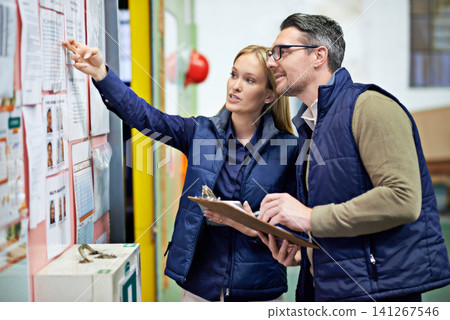 People, business and checking schedule with board in warehouse with calendar for order details. Man, woman and together with checklist or clipboard for supplier information and inventory updates 141267546