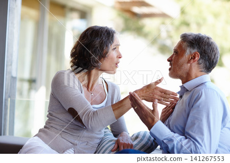 Divorce, fight and mature couple at home with anger, stress or frustrated by cheating, liar or conflict. Marriage, crisis or aggressive people argue on a patio with doubt, confrontation or disaster Divorce, fight and mature couple at home with anger, stress or frustrated by cheating, liar or conflict. Marriage, crisis or aggressive people argue on a patio with doubt, confrontation or disaster 141267553