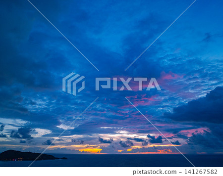 Aerial view beautiful pink cloud in sunset above Patong beach. Aerial view beautiful pink cloud in sunset above Patong beach. 141267582
