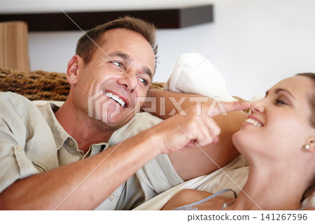 Couple, smile and touch nose for play in home, communication and having fun for bonding. Happy people, commitment and romance for date in living room, peace and affection for connection in lounge Couple, smile and touch nose for play in home, communication and having fun for bonding. Happy people, commitment and romance for date in living room, peace and affection for connection in lounge 141267596