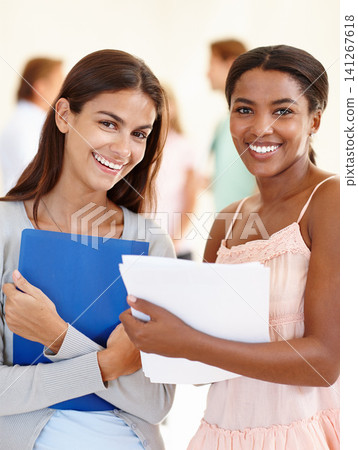 University, students and smiling in portrait with papers for education, assignment or research project with happiness. Diversity, friends or women with study materials for group work in college University, students and smiling in portrait with papers for education, assignment or research project with happiness. Diversity, friends or women with study materials for group work in college 141267618