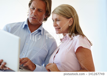 Solution, laptop or mature business people with teamwork, online update or support in a group project. Meeting, email and employees in office talking, conversation or speaking of a collaboration deal 141267749