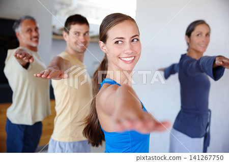 People, yoga and class with smile, fitness and wellness for mindfulness, wellbeing and health. Men, women and session at gym, studio and together for physical, activity and training in Virabhadrasana People, yoga and class with smile, fitness and wellness for mindfulness, wellbeing and health. Men, women and session at gym, studio and together for physical, activity and training in Virabhadrasana 141267750