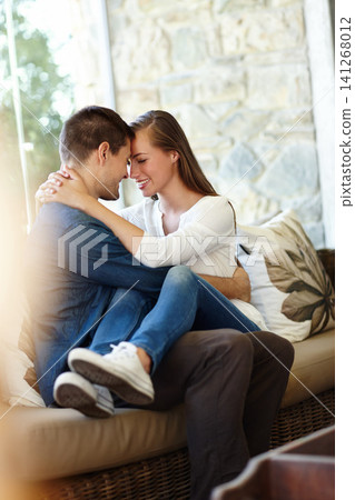 Home, couple and forehead for love, embrace and romance or care on couch in living room. Happy people, touch and smile for pride in relationship or commitment, loyalty and connection on hug date Home, couple and forehead for love, embrace and romance or care on couch in living room. Happy people, touch and smile for pride in relationship or commitment, loyalty and connection on hug date 141268012