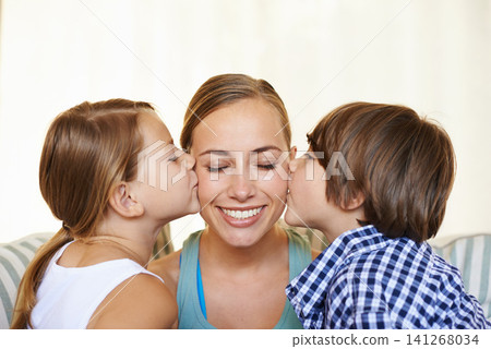 Mother, kids and kiss with smile, portrait and happy family for bonding in living room. Woman, children and home or house and positivity, love or lounge with childhood affection on sofa in apartment Mother, kids and kiss with smile, portrait and happy family for bonding in living room. Woman, children and home or house and positivity, love or lounge with childhood affection on sofa in apartment 141268034