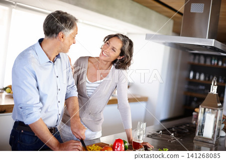 Food, love and senior couple cooking in kitchen with vegetables for healthy, breakfast at home. Support, retirement and old people in house with salad for diet, balance or meal prep nutrition 141268085
