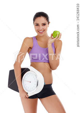 Portrait, scale and woman with wellness, apple and healthy person isolated on a white studio background. Face, happy girl and model with smile and exercise with diet plan and weight loss with fruit Portrait, scale and woman with wellness, apple and healthy person isolated on a white studio background. Face, happy girl and model with smile and exercise with diet plan and weight loss with fruit 141268410