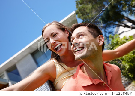 Outdoors, couple and piggyback on weekend for love, marriage and bonding by flying game. Happy people, freedom and laughing on holiday for humor and commitment to fun, loyalty and connection on date Outdoors, couple and piggyback on weekend for love, marriage and bonding by flying game. Happy people, freedom and laughing on holiday for humor and commitment to fun, loyalty and connection on date 141268497