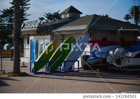 Tourist surfboard rental and boat shack in Essaouira Morocco showing coastal culture and authenticity Tourist surfboard rental and boat shack in Essaouira Morocco showing coastal culture and authenticity 141268501