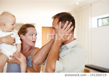 Couple, child and argument with home, family problem and frustration or anger for domestic life. Father, mother and kid in house, living room and problem with communication for parenting relationship Couple, child and argument with home, family problem and frustration or anger for domestic life. Father, mother and kid in house, living room and problem with communication for parenting relationship 141268519